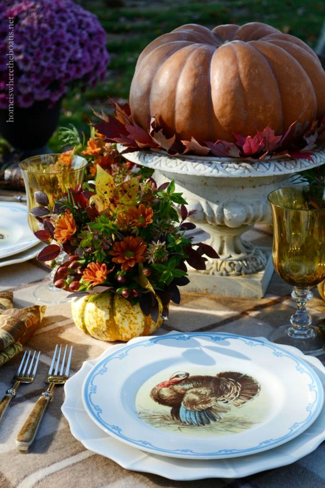 Thanksgiving Table Decoration With Warm Plaid Layers And Pumpkins