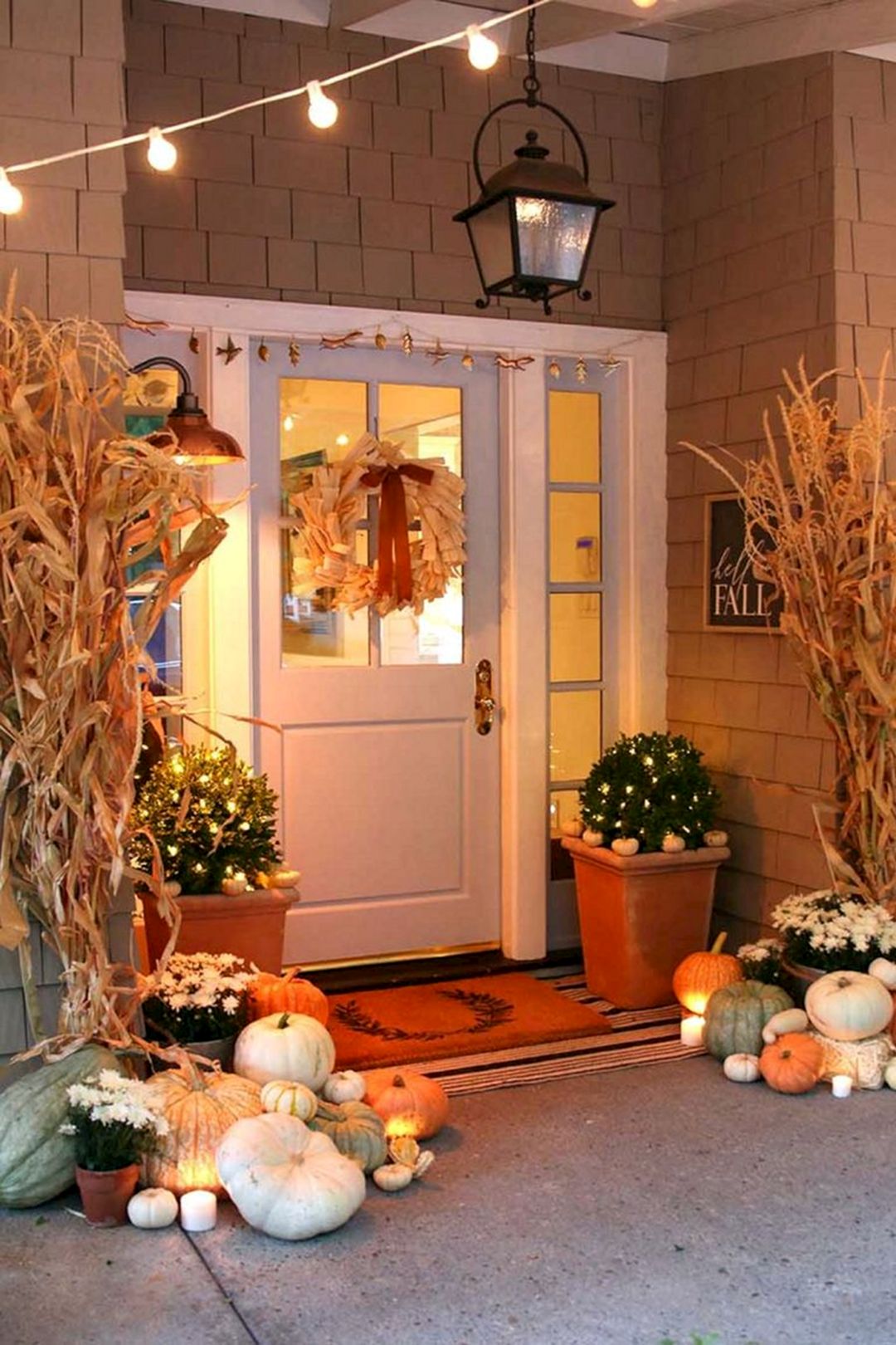 Neutral fall porch decor with pumpkins