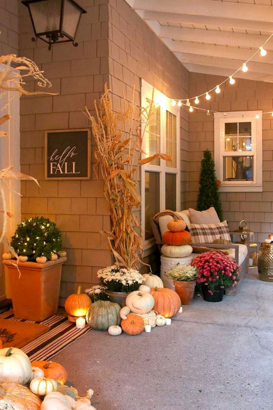 Neutral fall porch decor with pumpkins